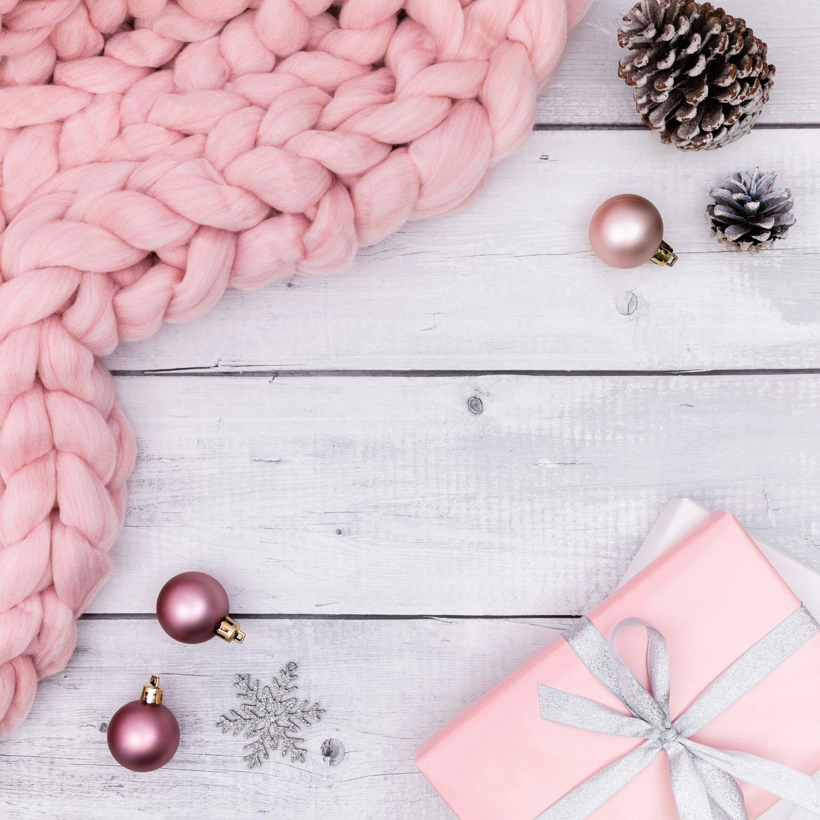 a pink flower next to a pink flower and a pink ribbon